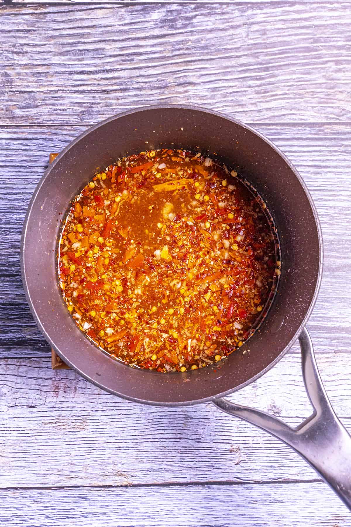 Thai Sweet Chili Sauce ingredients simmering in a pot