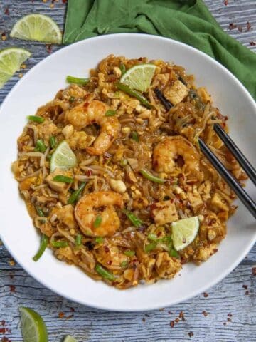 Pad Thai in a bowl with chopsticks