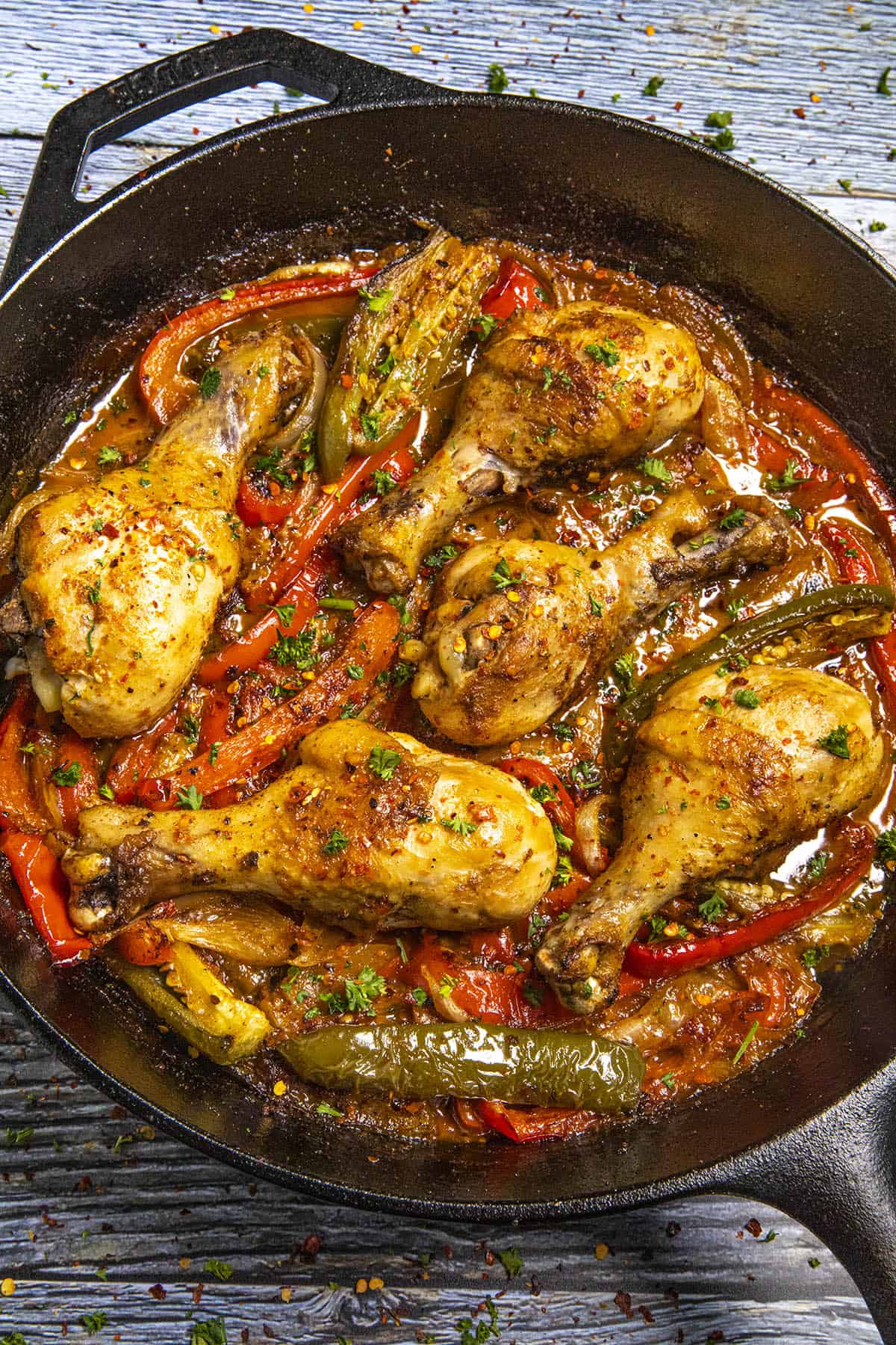 Italian Chicken Drumsticks ready to serve with lots of roasted peppers
