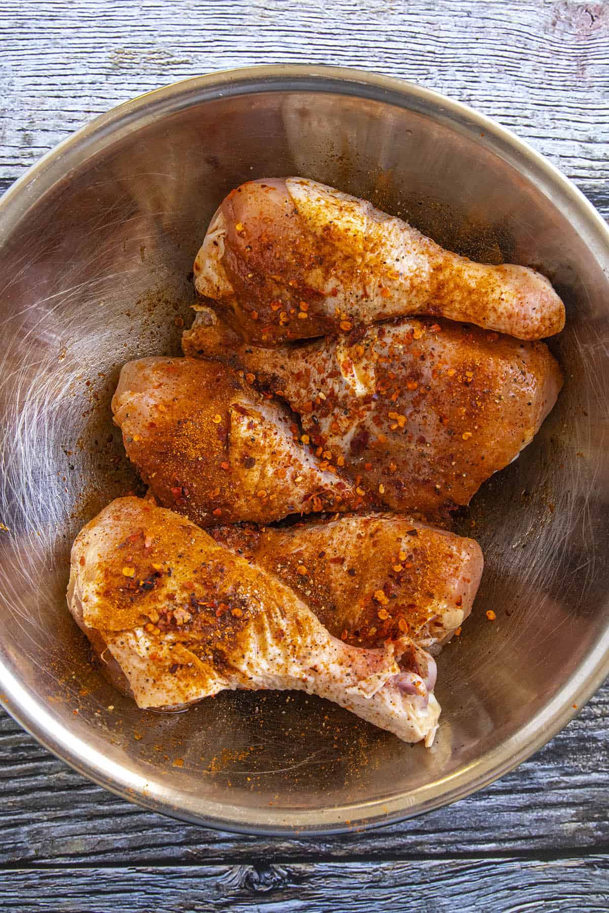 Seasoning Chicken Drumsticks in a bowl