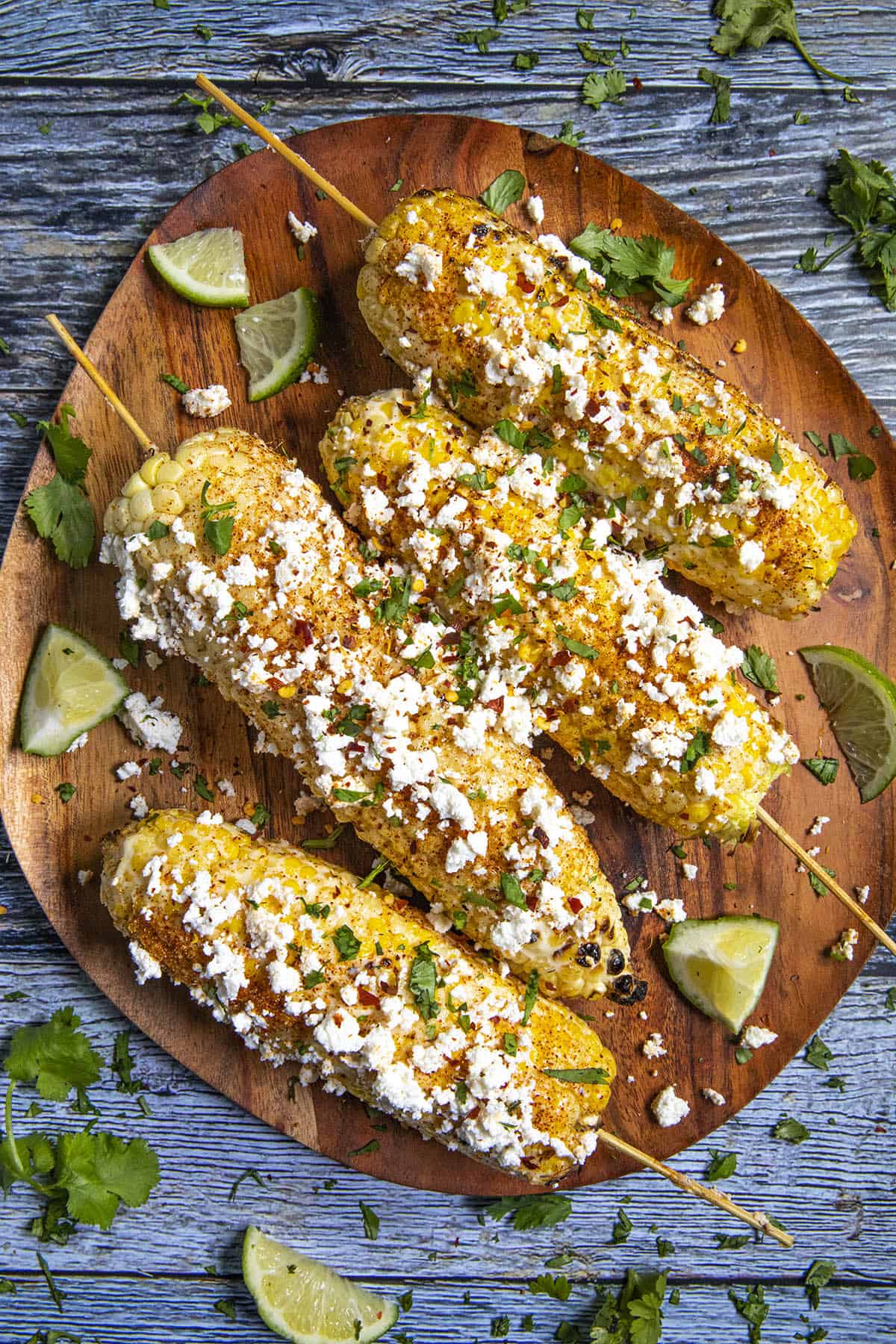 4 Elotes on a platter, ready to serve