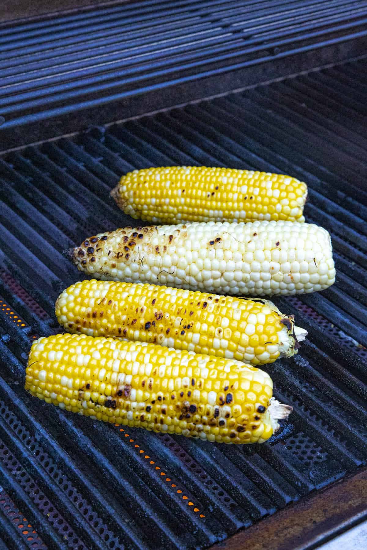Grilling corn to make elotes