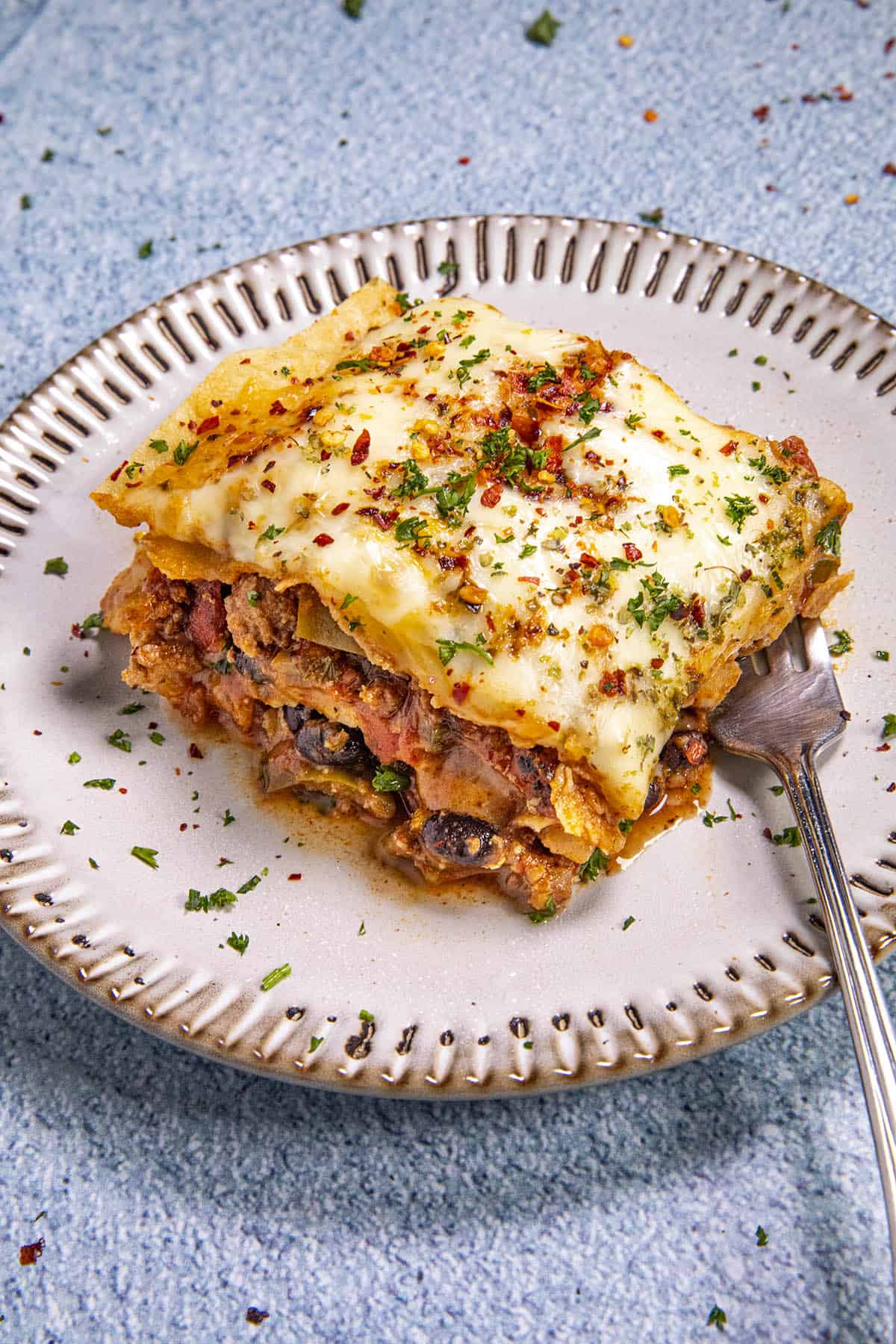 A slice of Mexican Lasagna on a plate