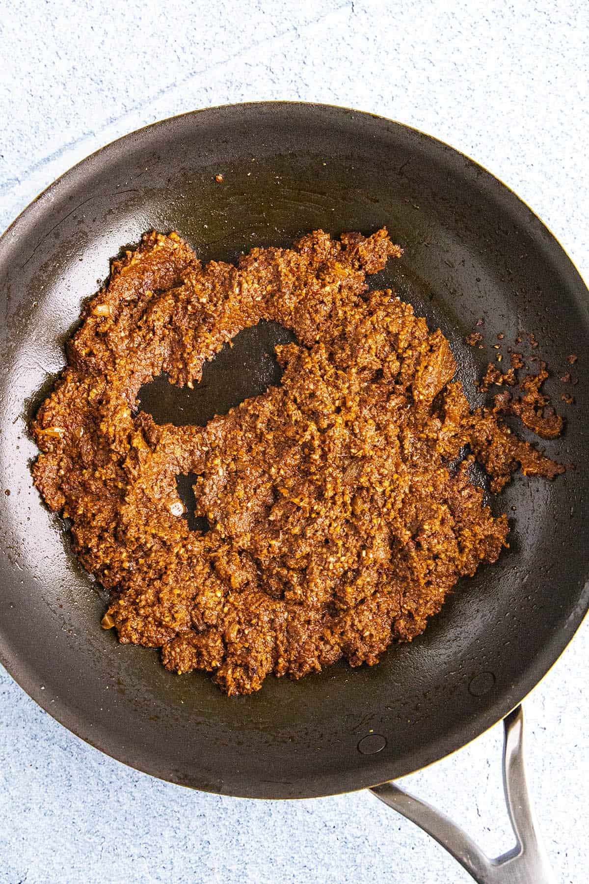 Cooking the pipian paste in a pan