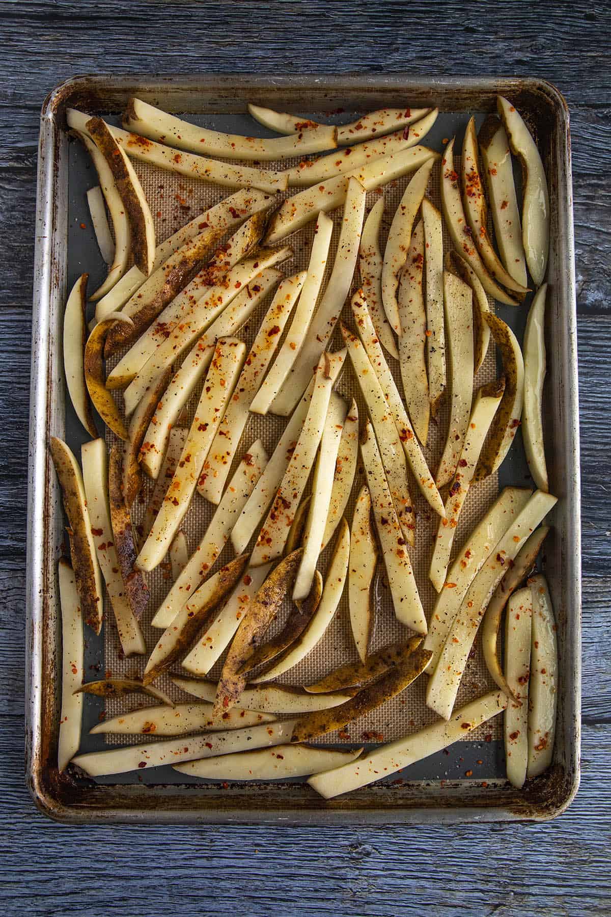 Seasoned french fries, ready for the oven