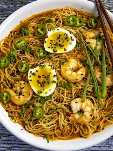 Spicy Ramen noodles in a bowl with jammy eggs