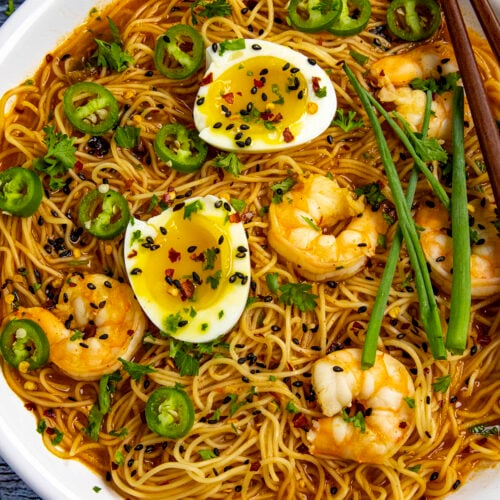 Spicy Ramen noodles in a bowl with jammy eggs