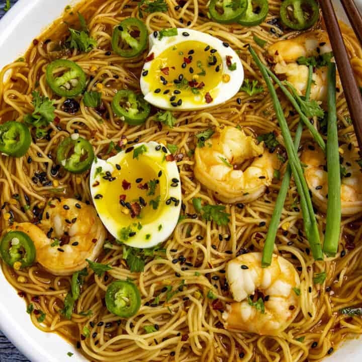 Spicy Ramen noodles in a bowl with jammy eggs