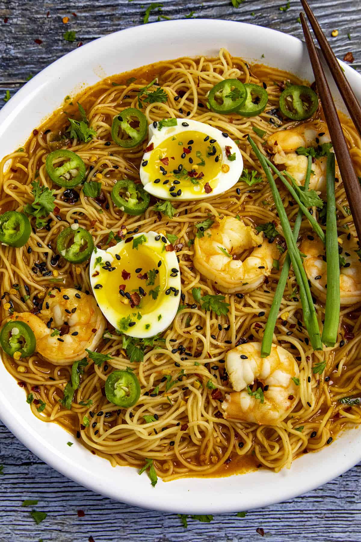 Spicy Ramen noodles in a bowl with jammy eggs