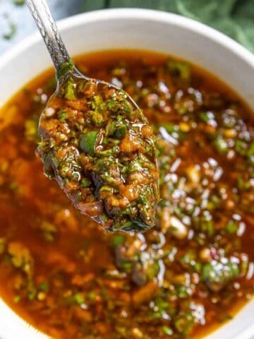 Spooning Chermoula sauce from the bowl