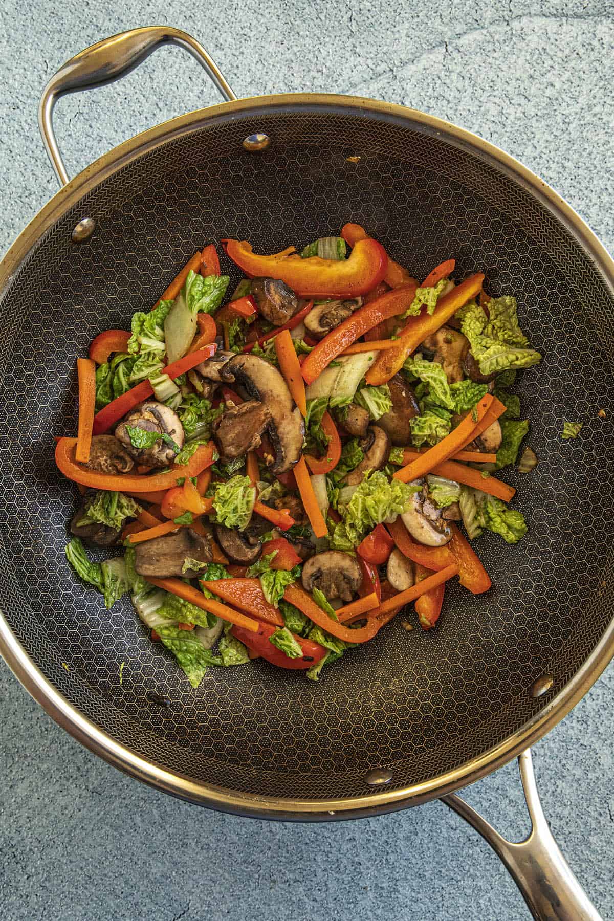 Stir frying the first round of vegetables in a hot pan