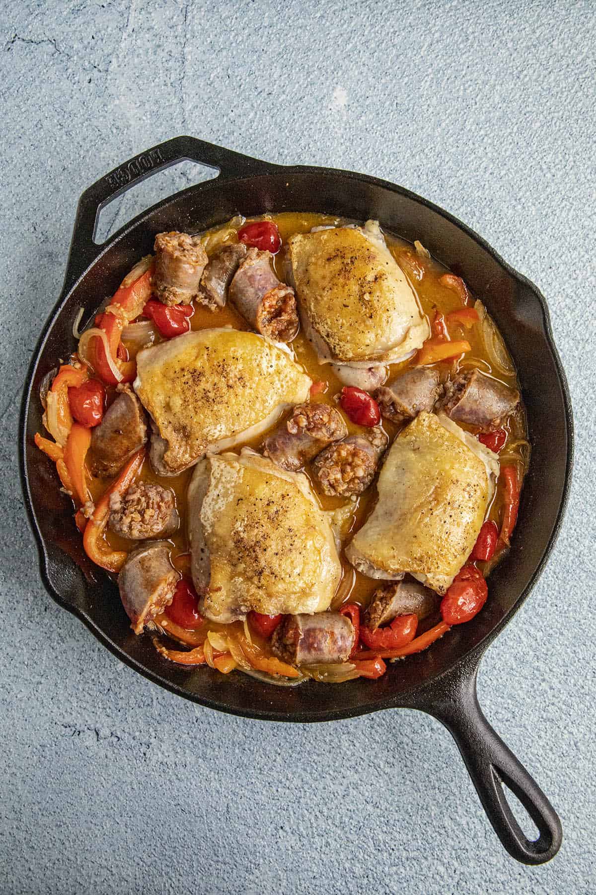 Chicken Scarpariello in a pan, just before braising in the oven