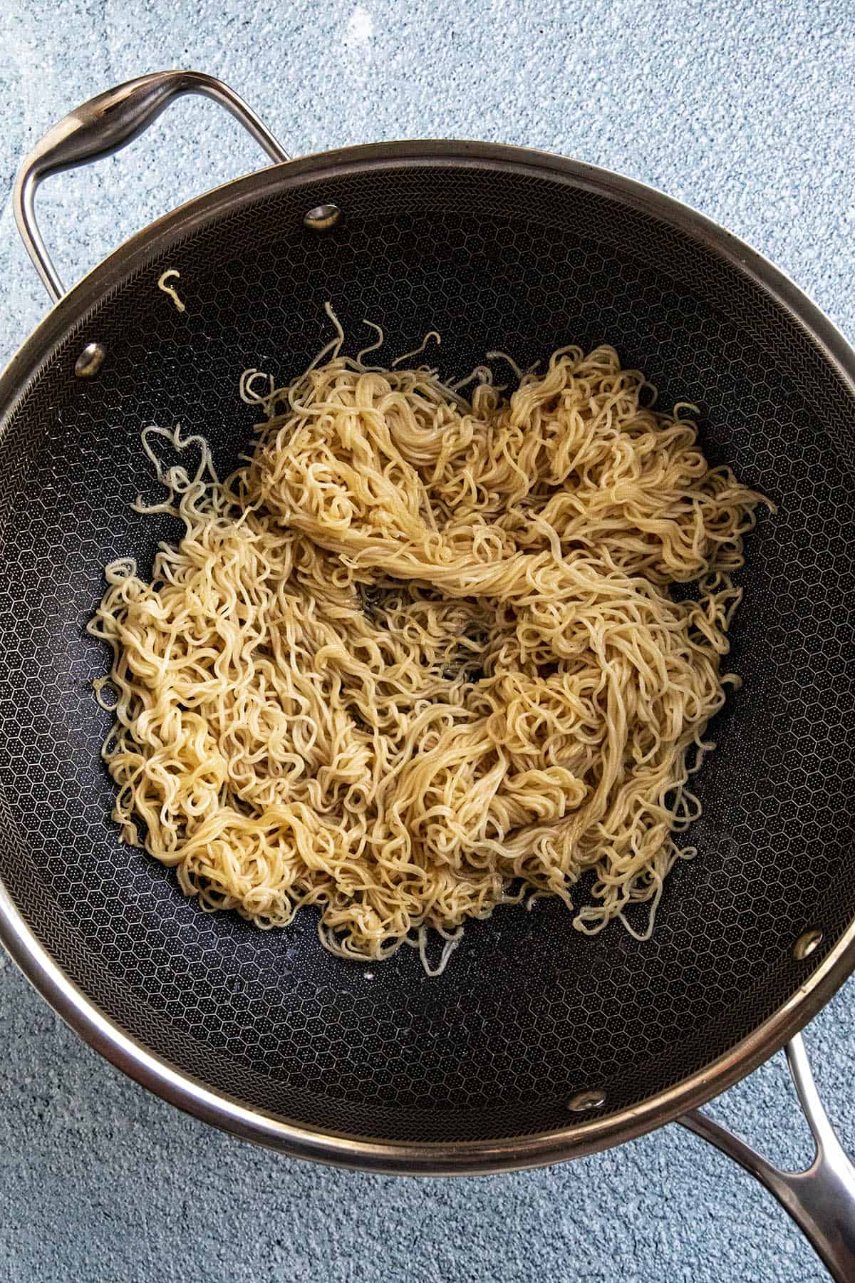 Stir frying the noodles to make Chow Mein