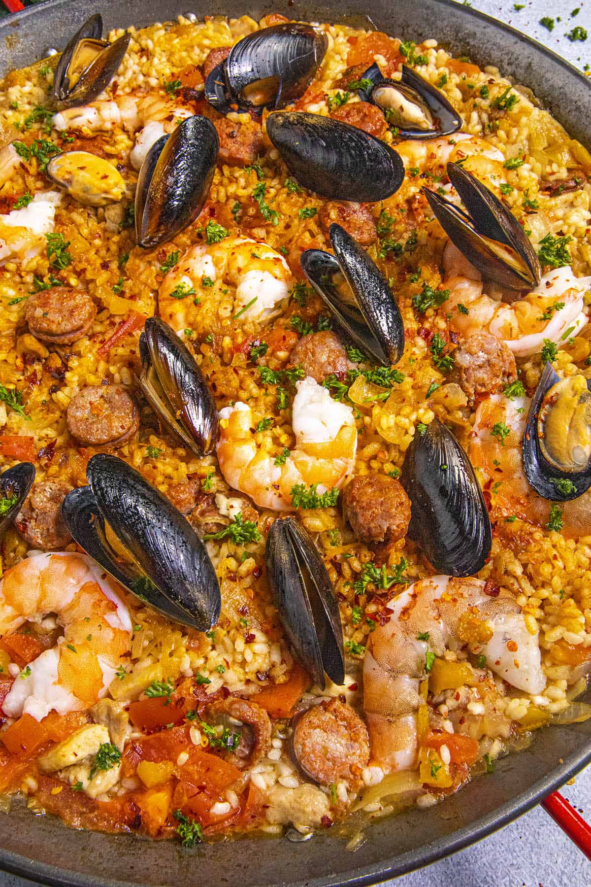 Paella in a pan with lots of seafood