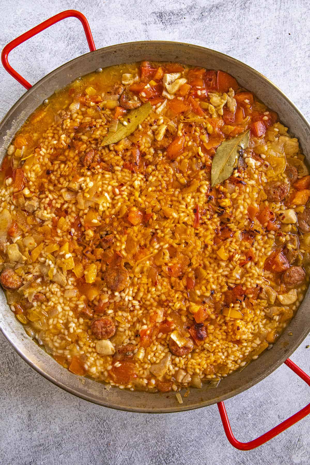 Simmering paella in a large pan