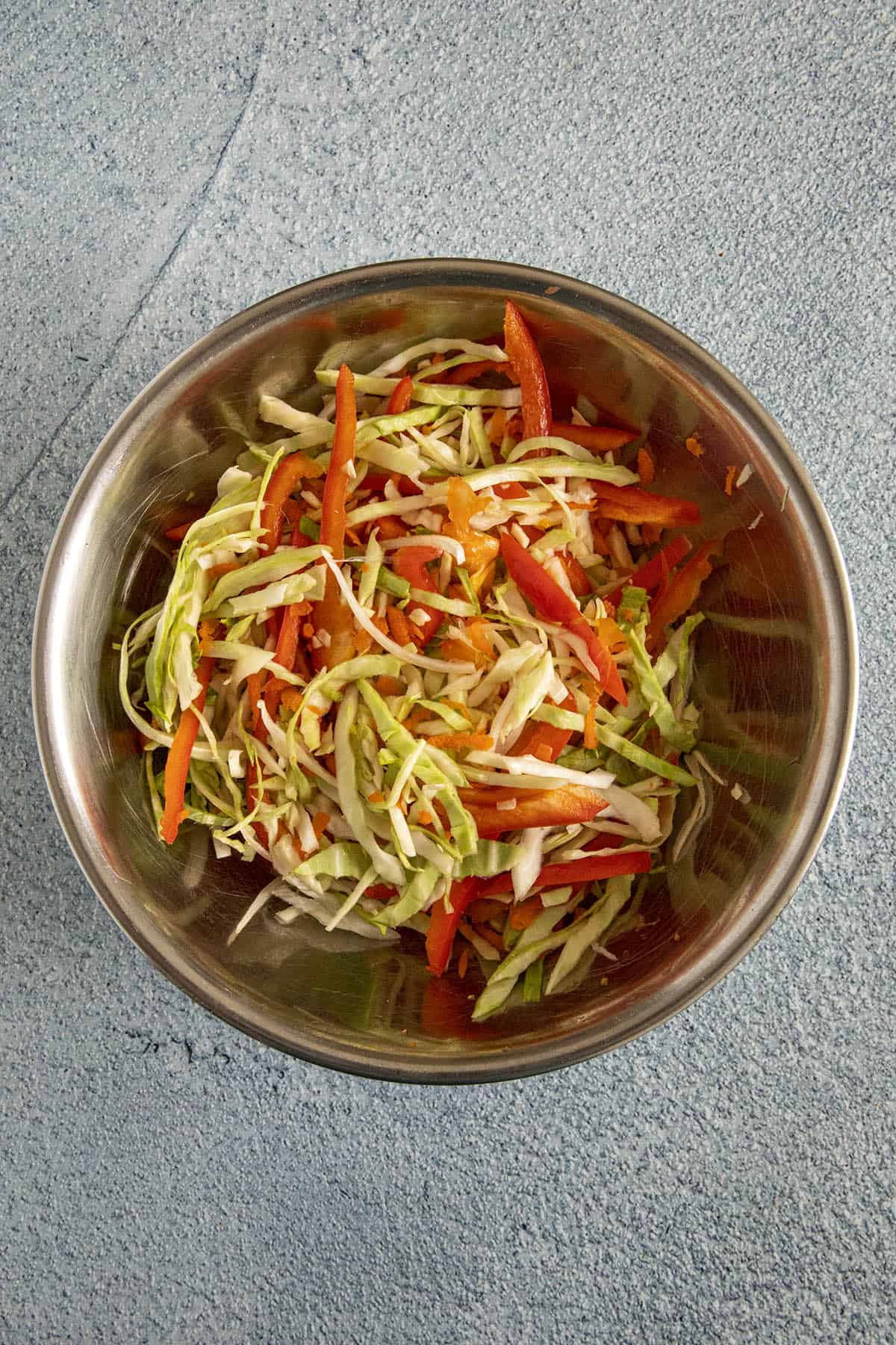 Shredded vegetables in a bowl for making Pikliz