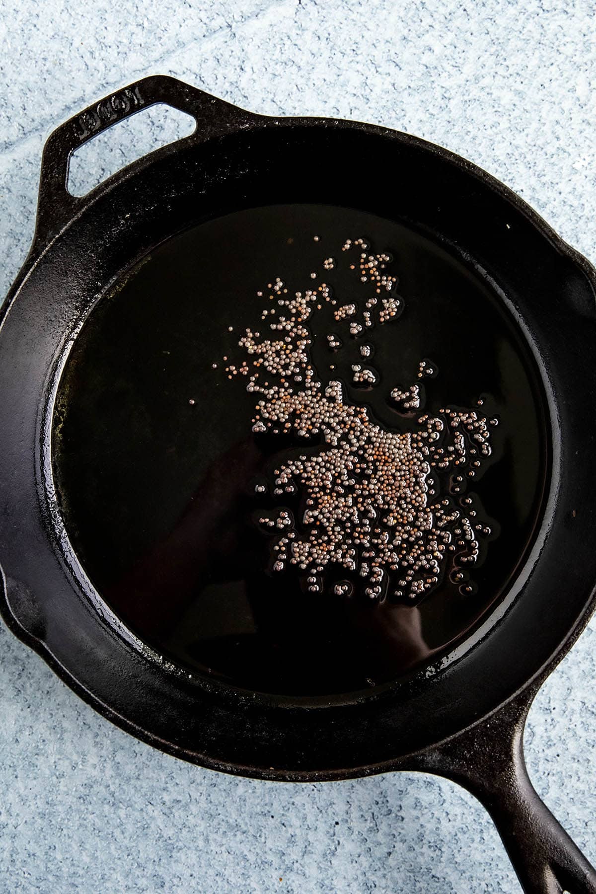 Heating mustard seeds in a hot pan