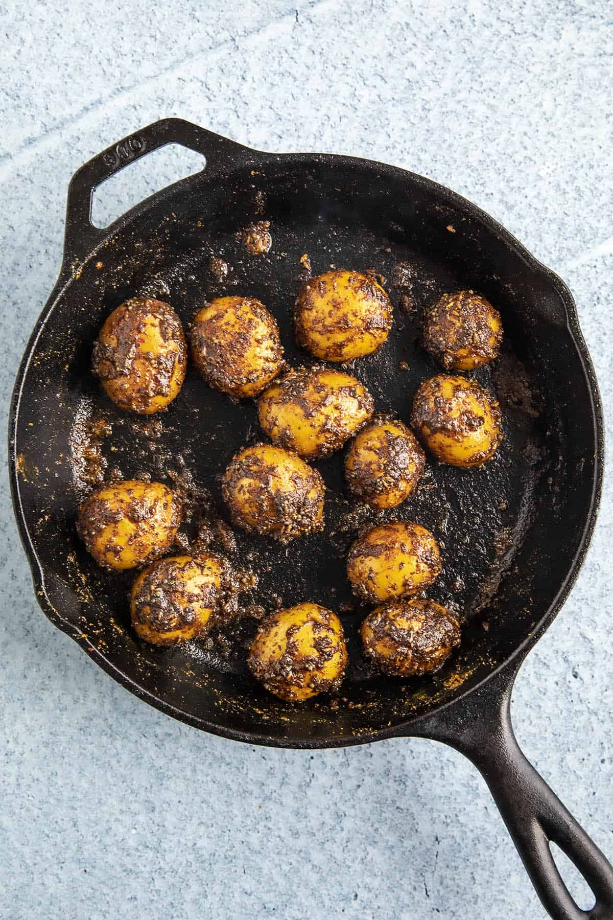 Finishing the Bombay Potatoes in a hot pan