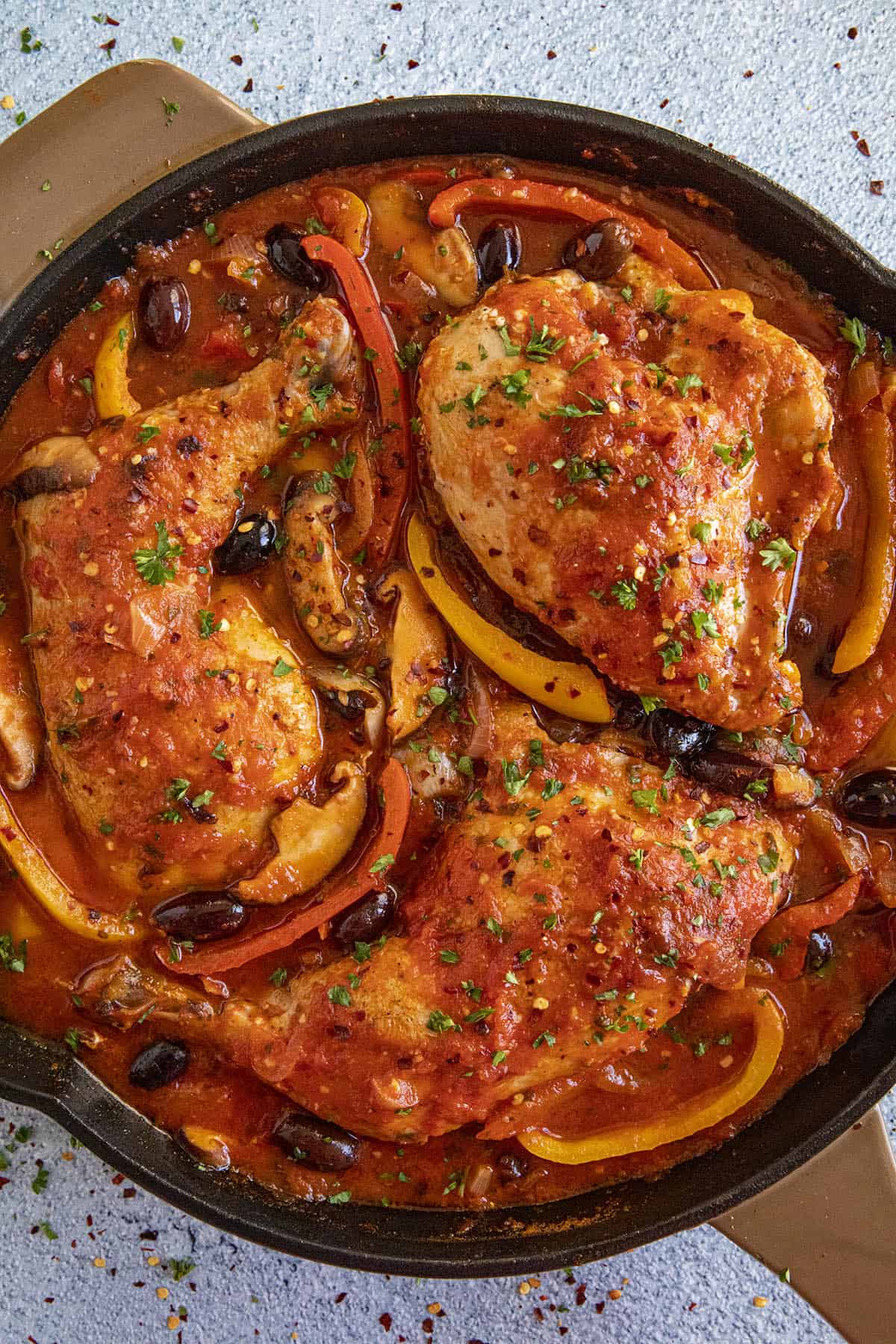 Chicken Cacciatore in a pan with peppers and olives