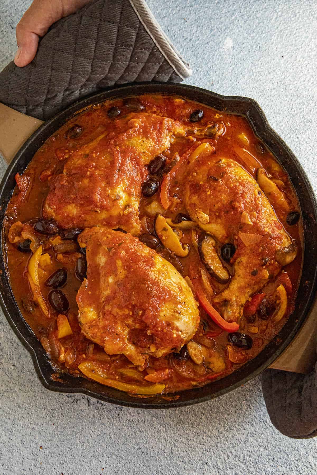 Mike serving a hot pan of Chicken Cacciatore