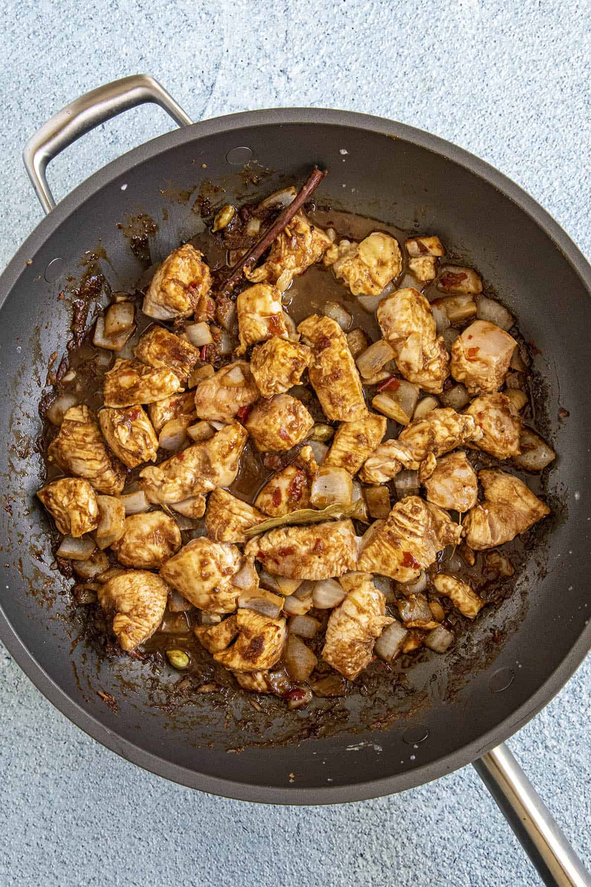 Cooking chicken in the pan to make Massaman Curry