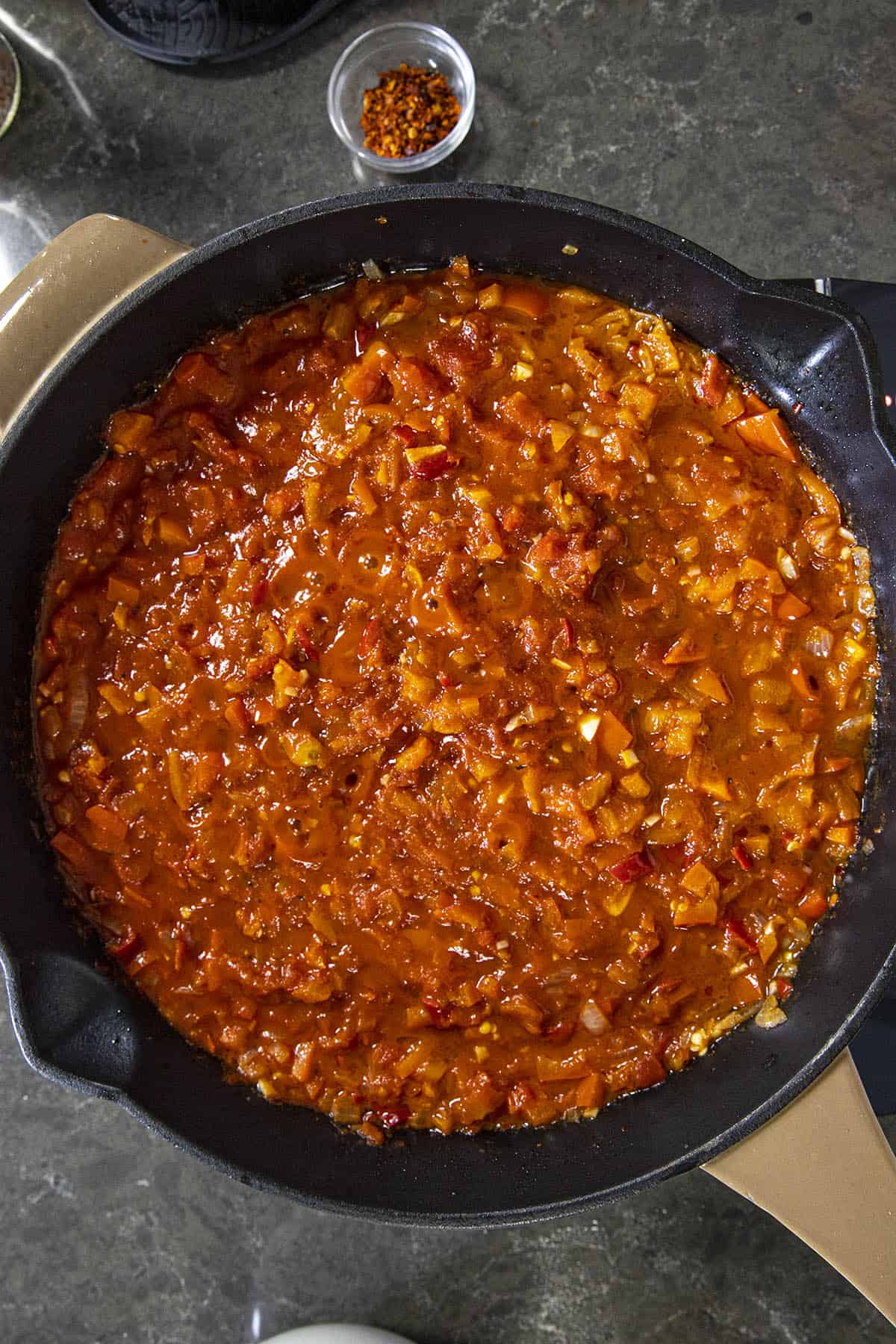 Simmering tomatoes and peppers to make Menemen