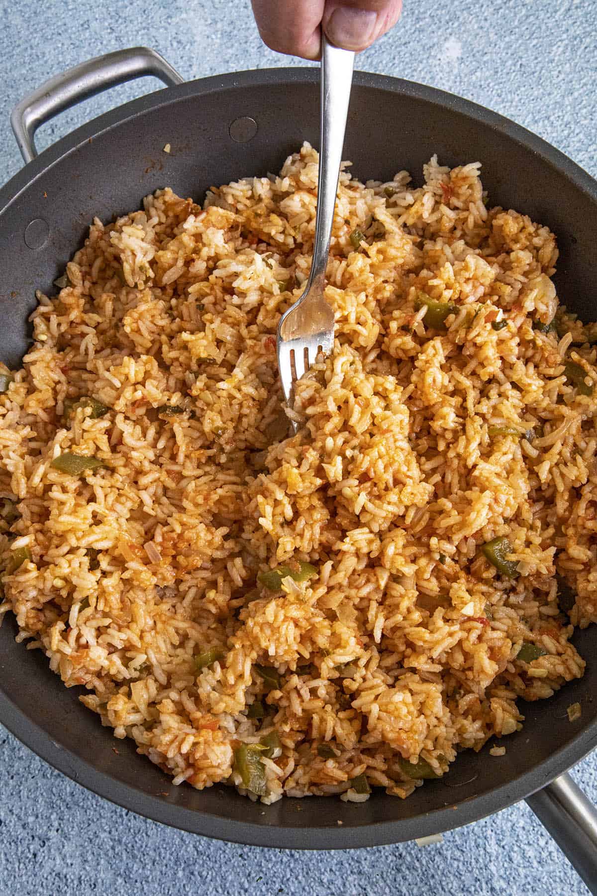 Fluffing Mexican Rice with a fork
