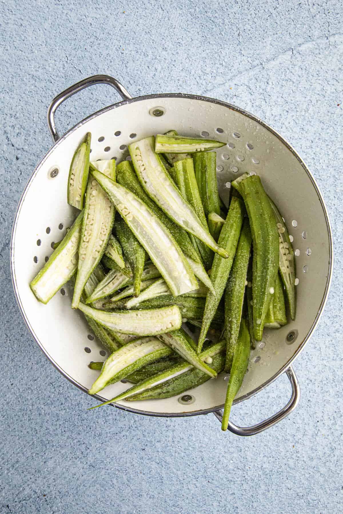 Draining okra in a colander