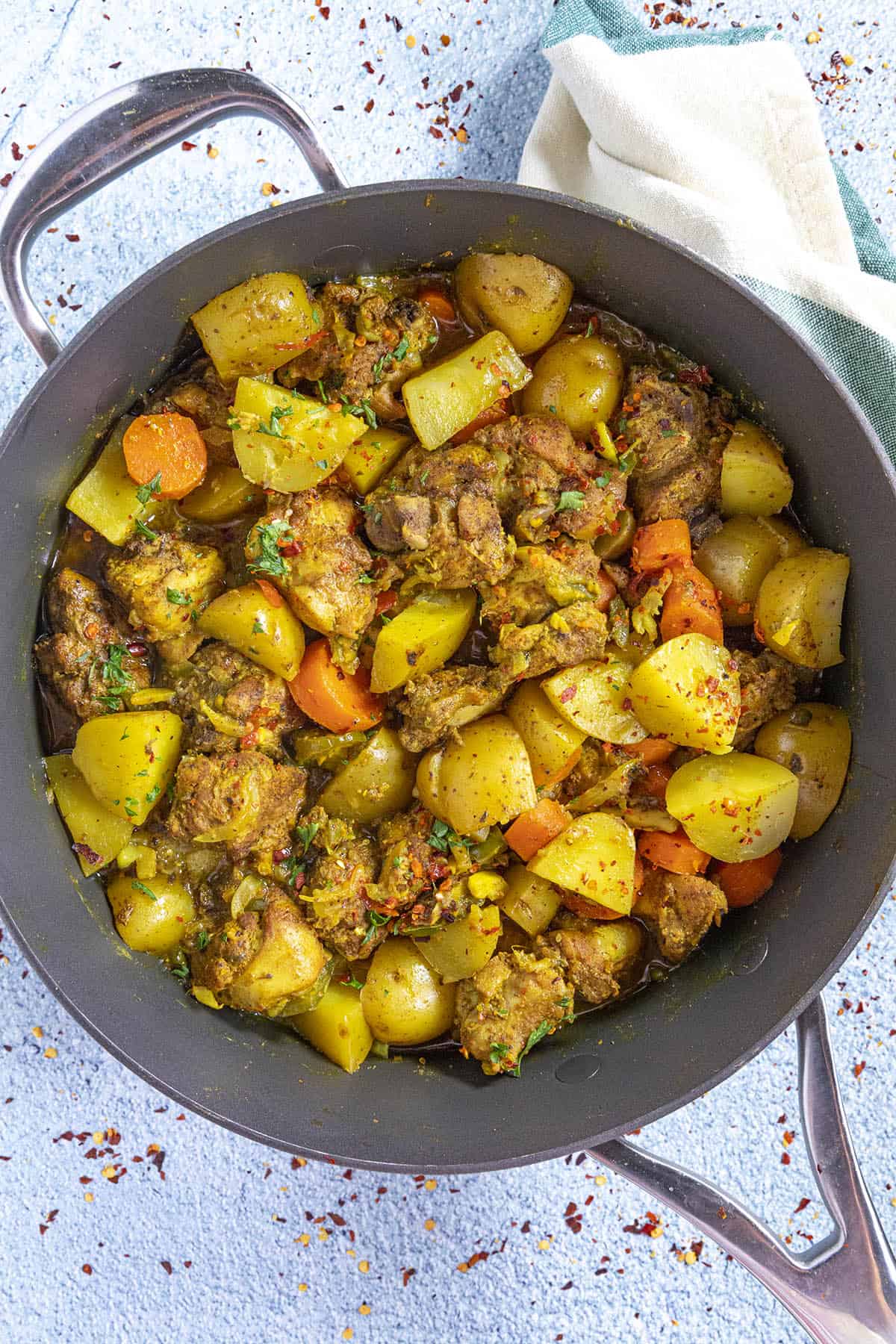 Jamaican Curry Chicken in a pan, ready to serve