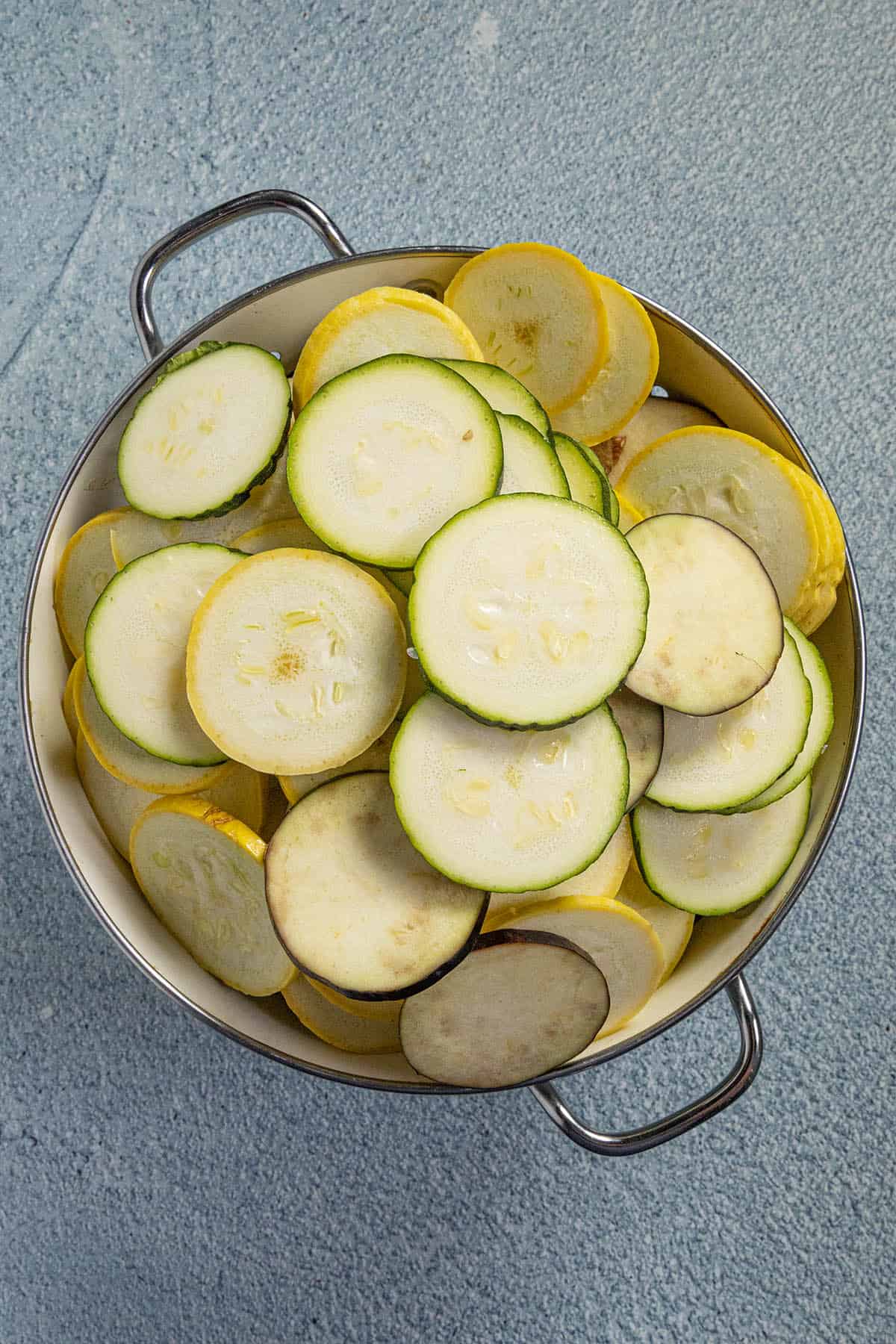 Draining the sliced vegetables of moisture to make Ratatouille