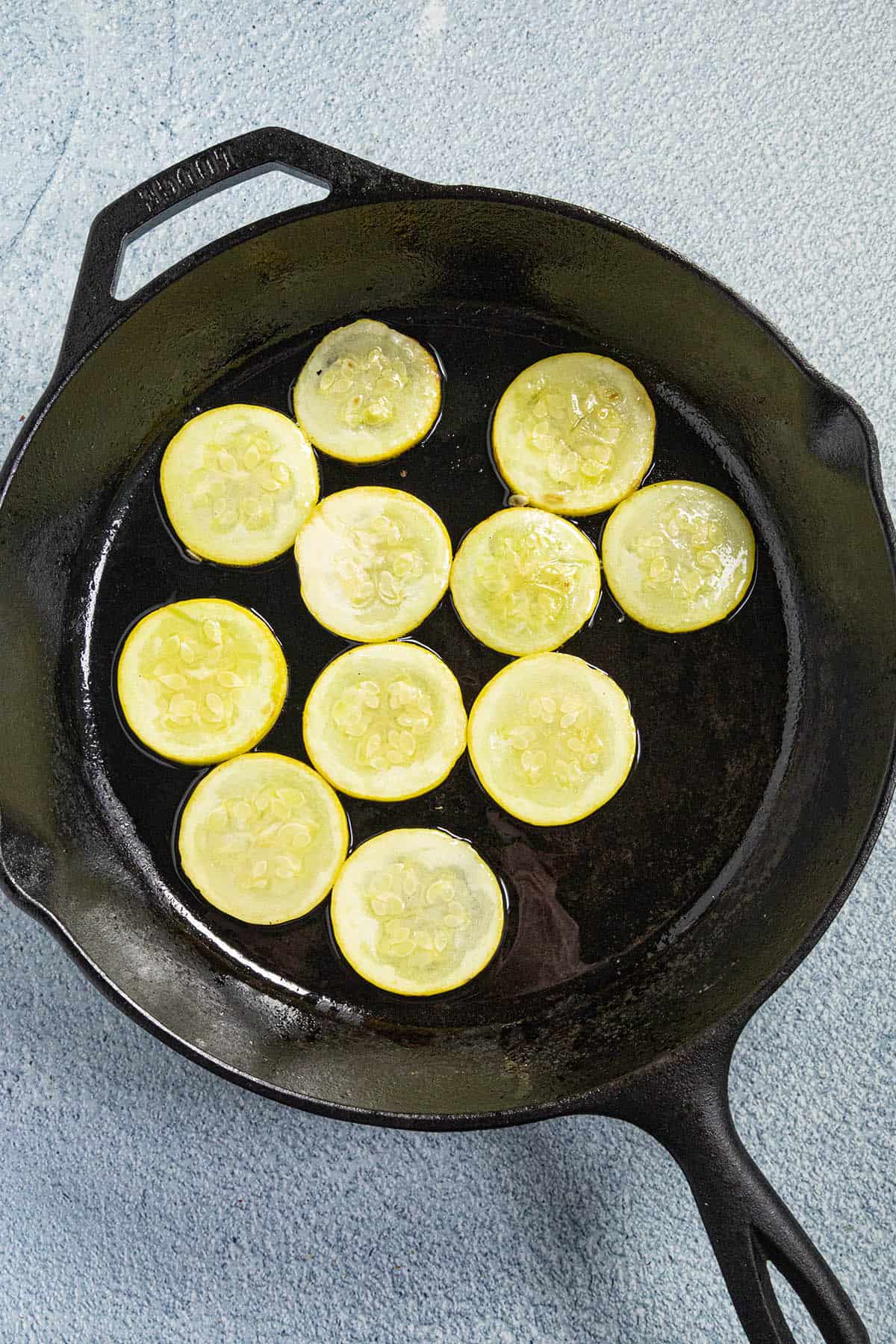 Sauteeing each of the vegetables in a single layer to make Ratatouille