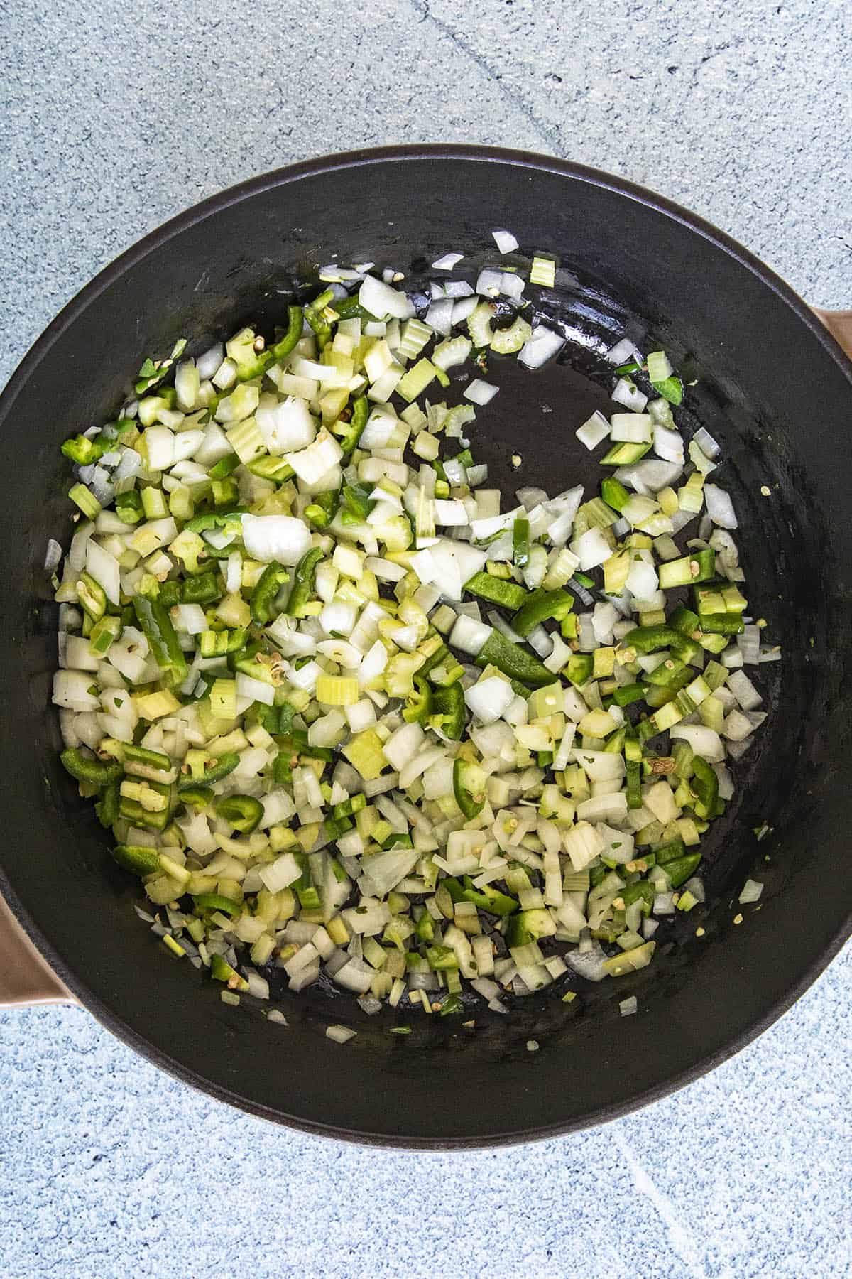 Cajun Red Beans and Rice with Andouille - Recipe Cooking vegetables in a pot to make Red Beans and Rice