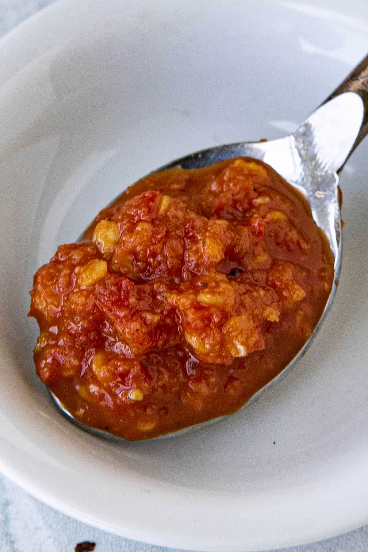 Homemade Chili Garlic Sauce on a spoon
