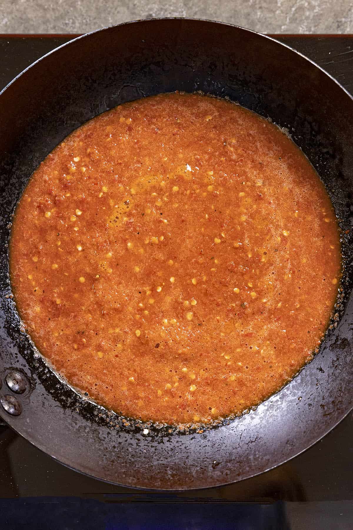 Homemade Chili Garlic Sauce simmering in a pan