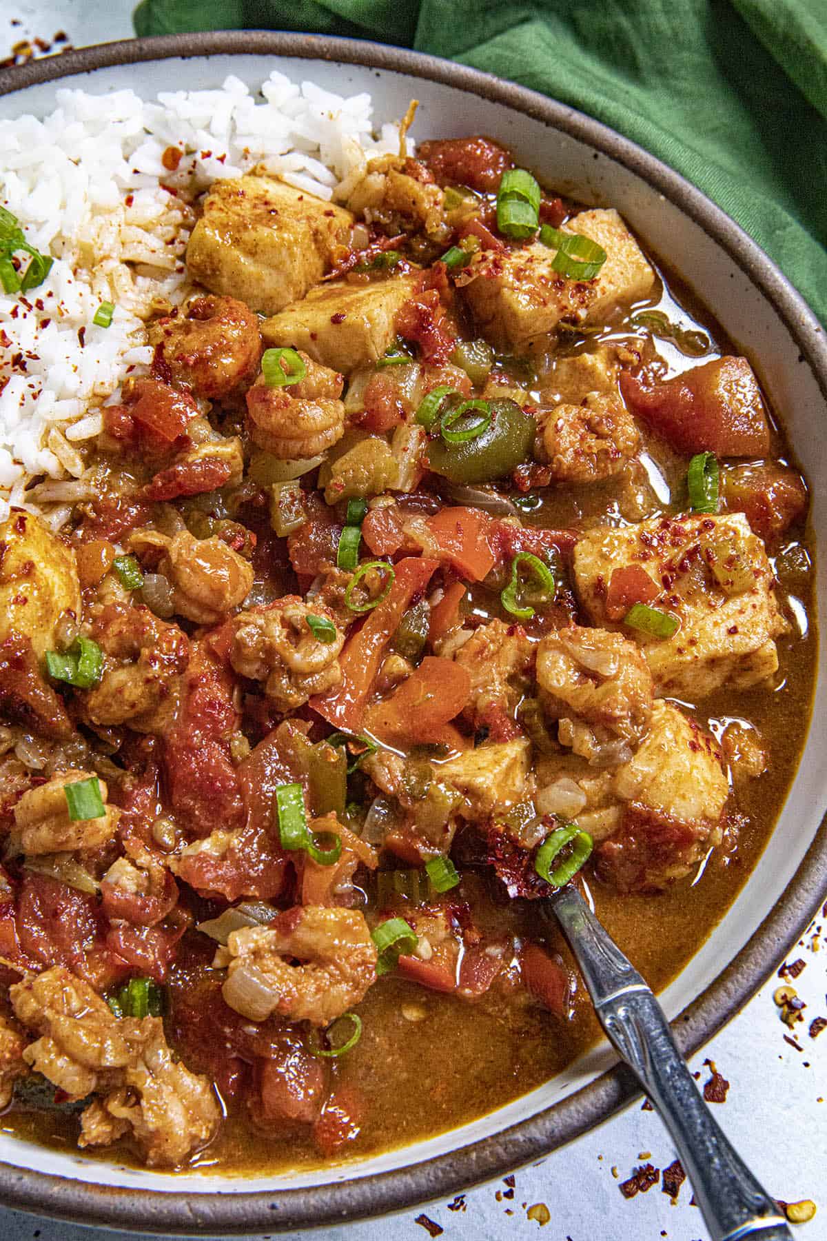 Couvillion in a bowl over rice with lots of seafood