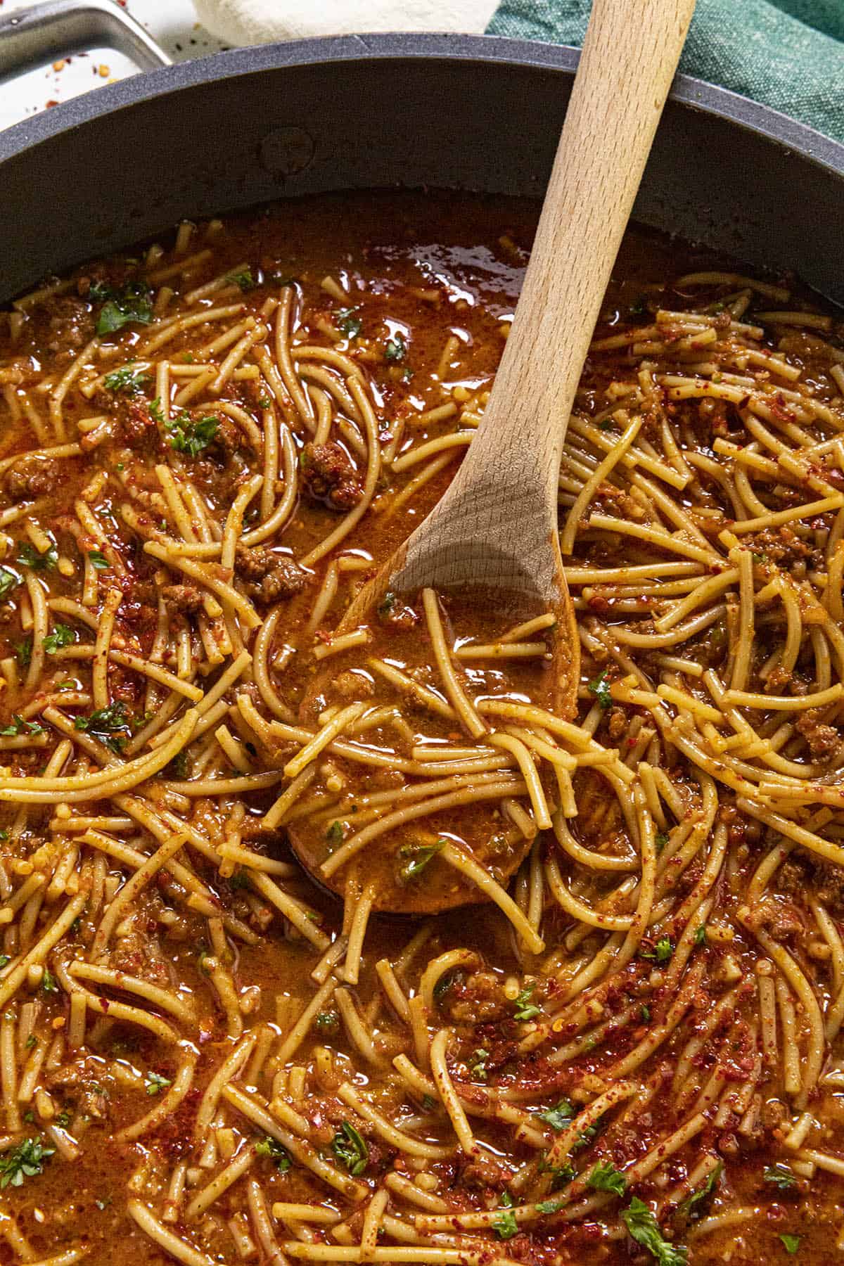 Mike taking a scoop of Sopa de Fideo from the hot pan