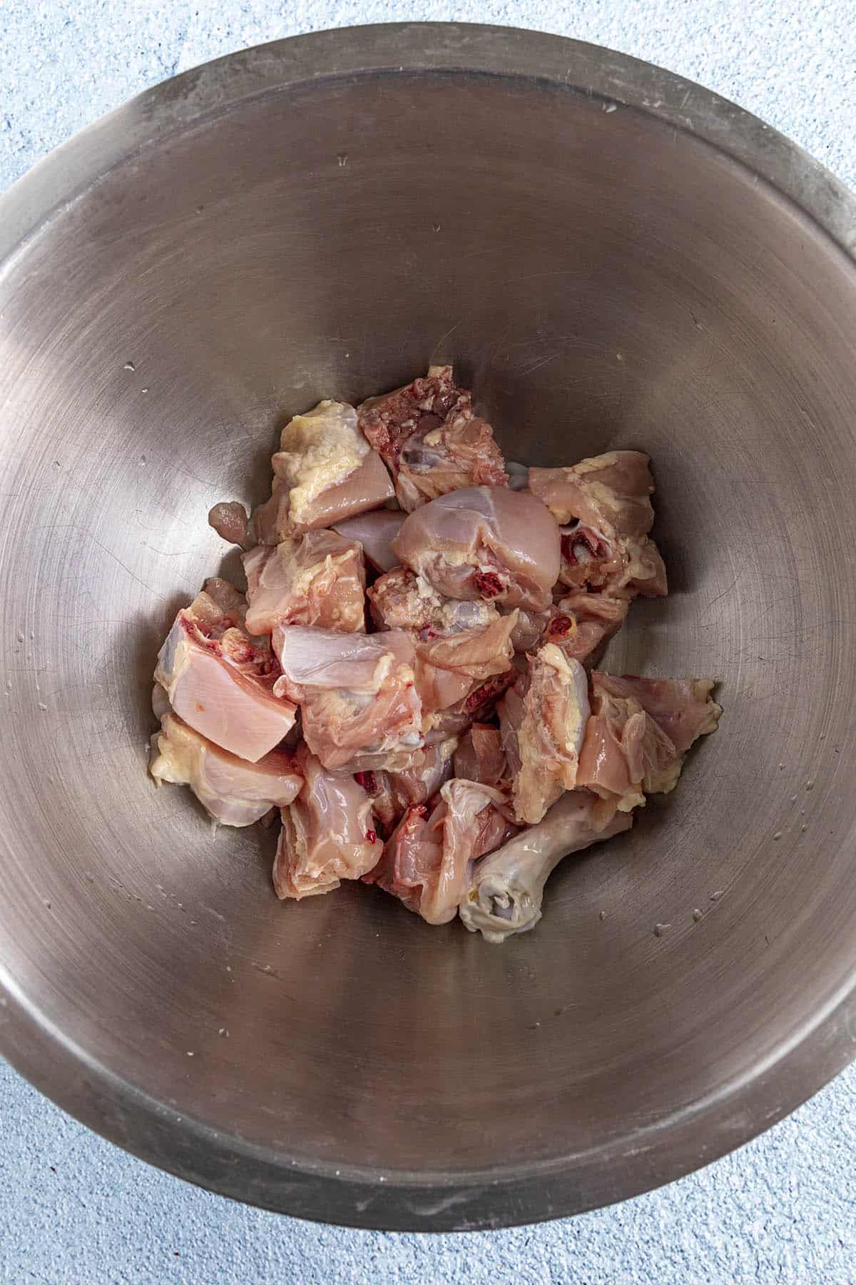 Chopped chicken in a bowl for making Jamaican Curry Chicken