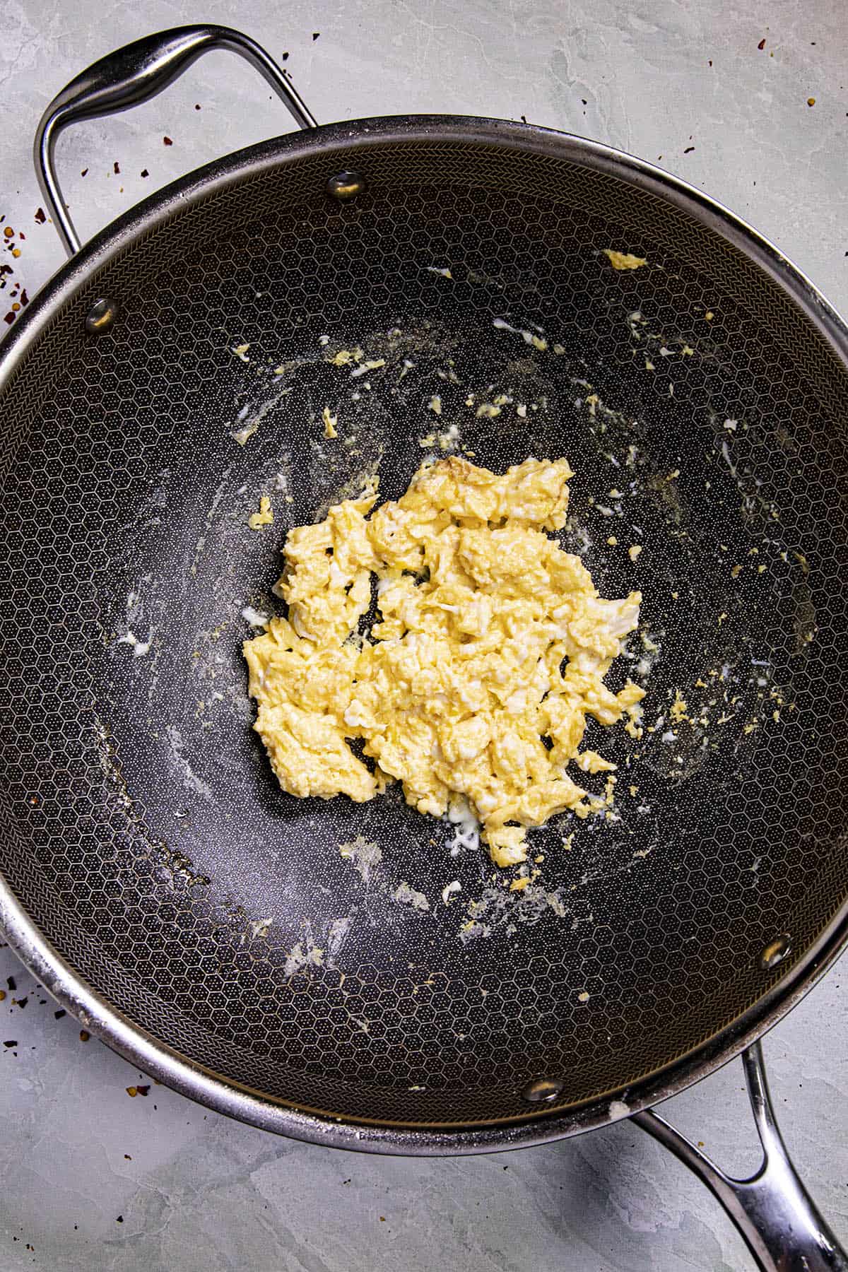 Cooking the eggs to make Shrimp Fried Rice