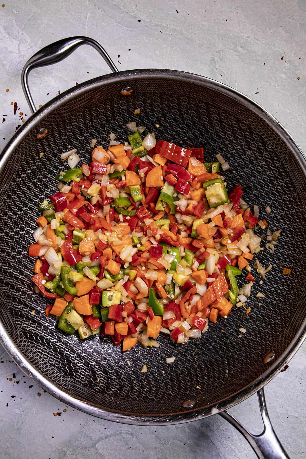 Cooking the vegetables to make Shrimp Fried Rice