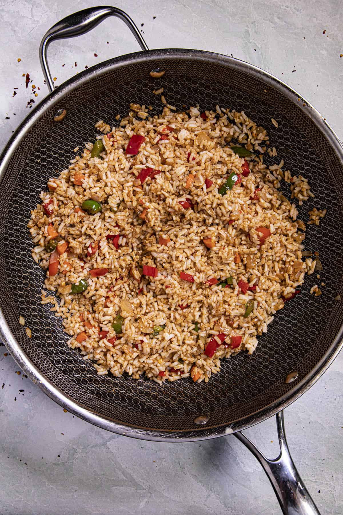 Stir frying the rice to make Shrimp Fried Rice