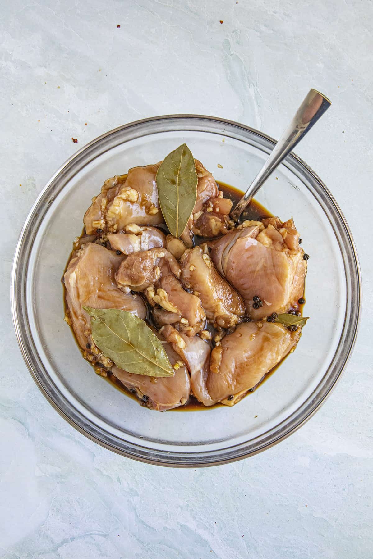 Marinating chicken to make Chicken Adobo