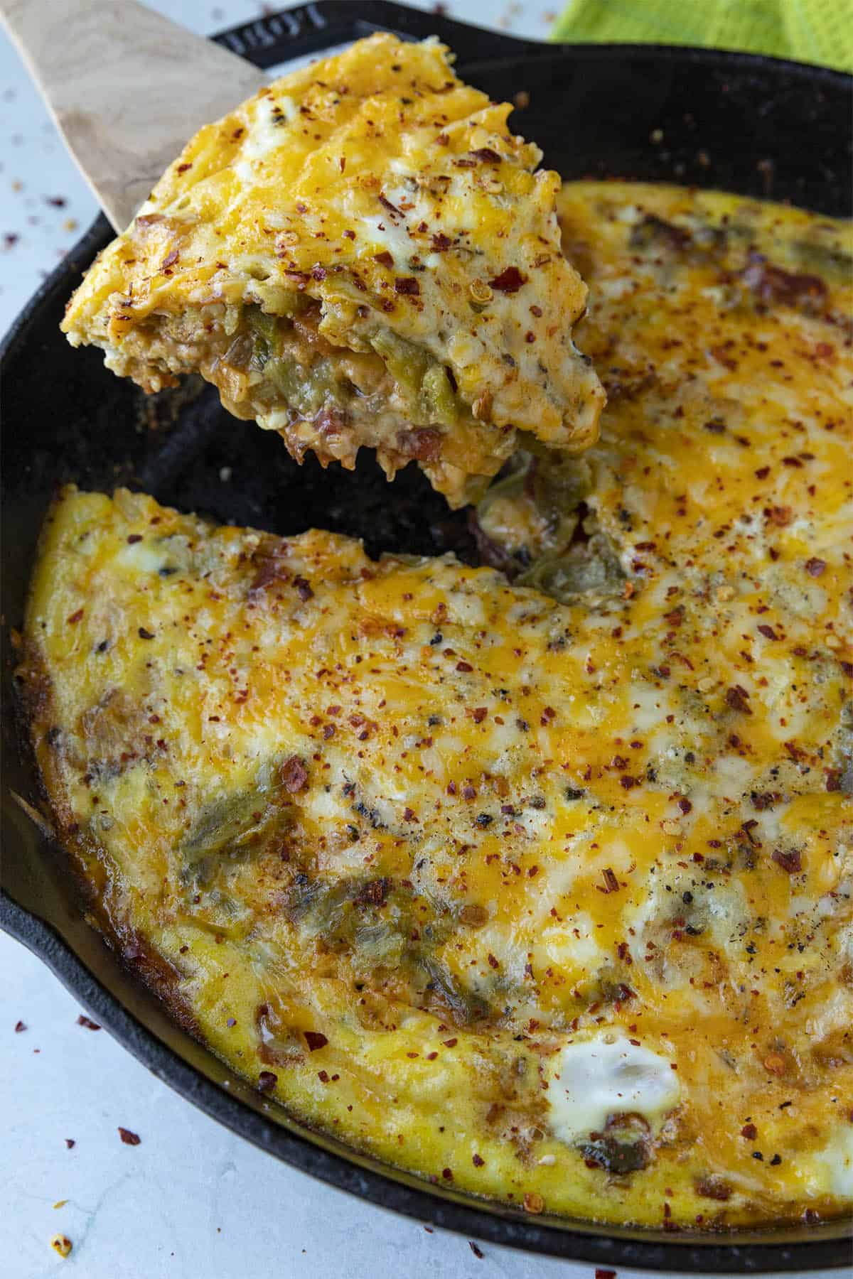 Mike serving a slice of Chile Relleno Casserole