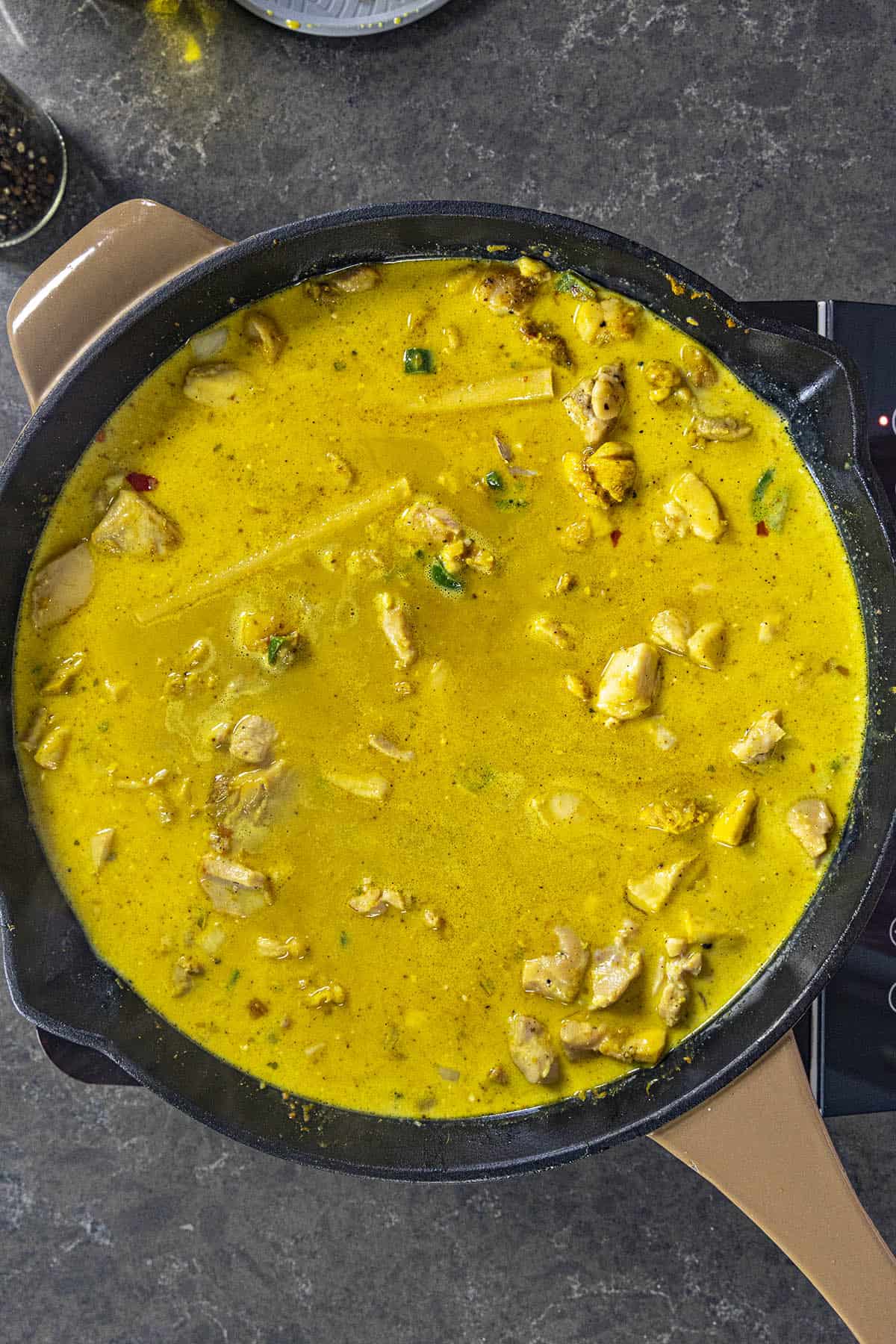Coconut Curry Chicken simmering in a pan