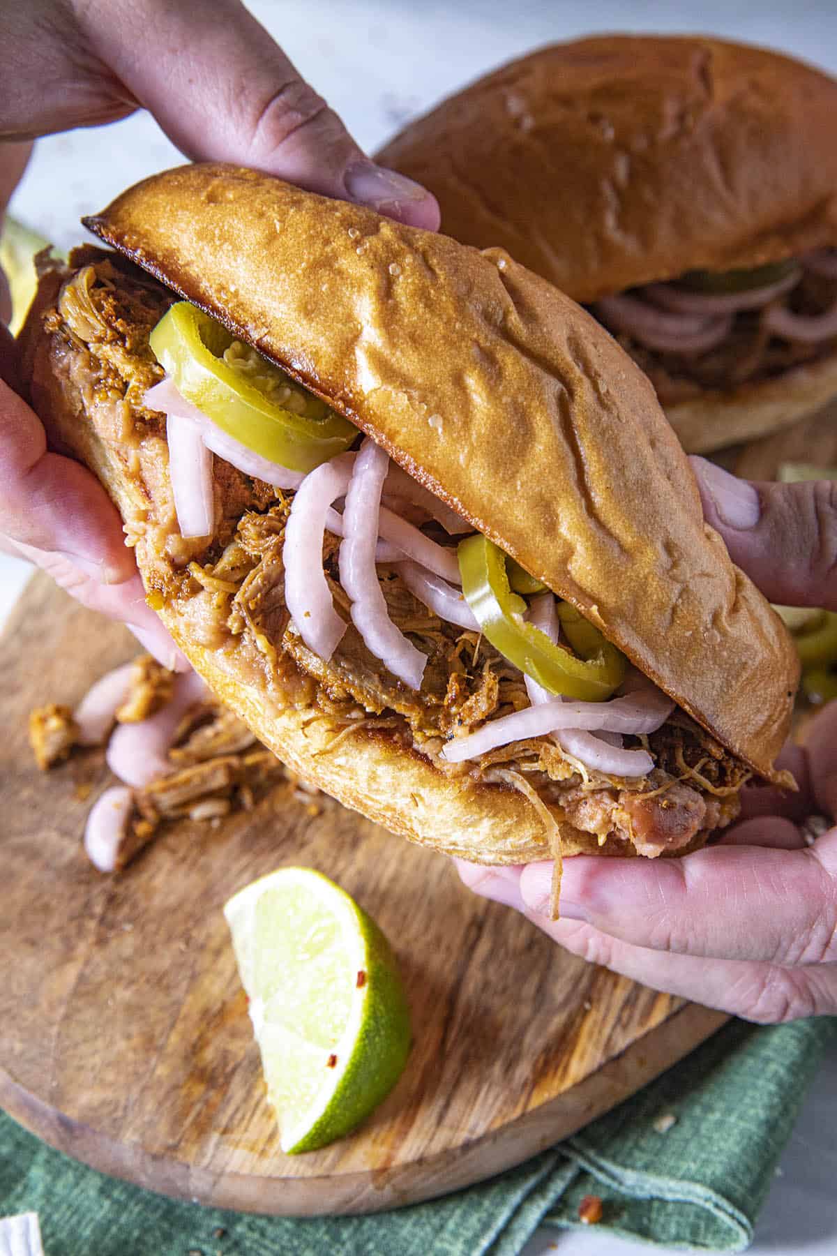 Mike holding a Mexican Torta de Cochinita Pibil