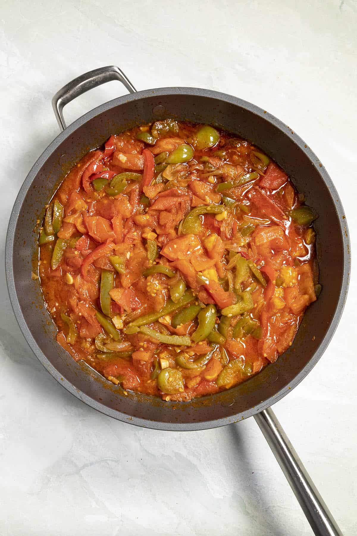 Piperade simmering in a pan
