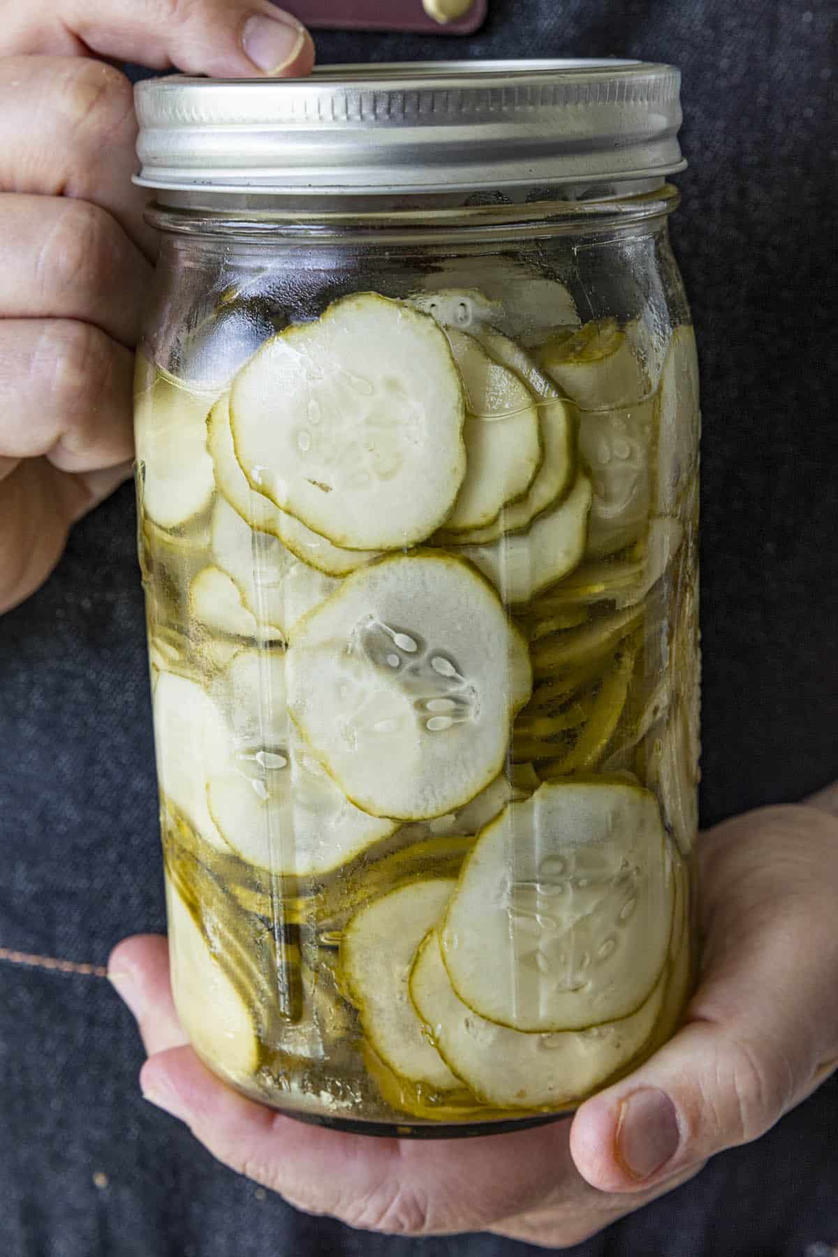 Mike holding Refrigerator Pickles in a jar