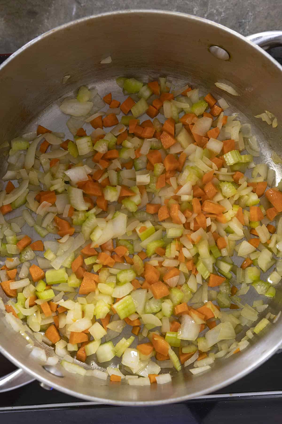 Cooking down the vegetables to make Roasted Poblano Soup