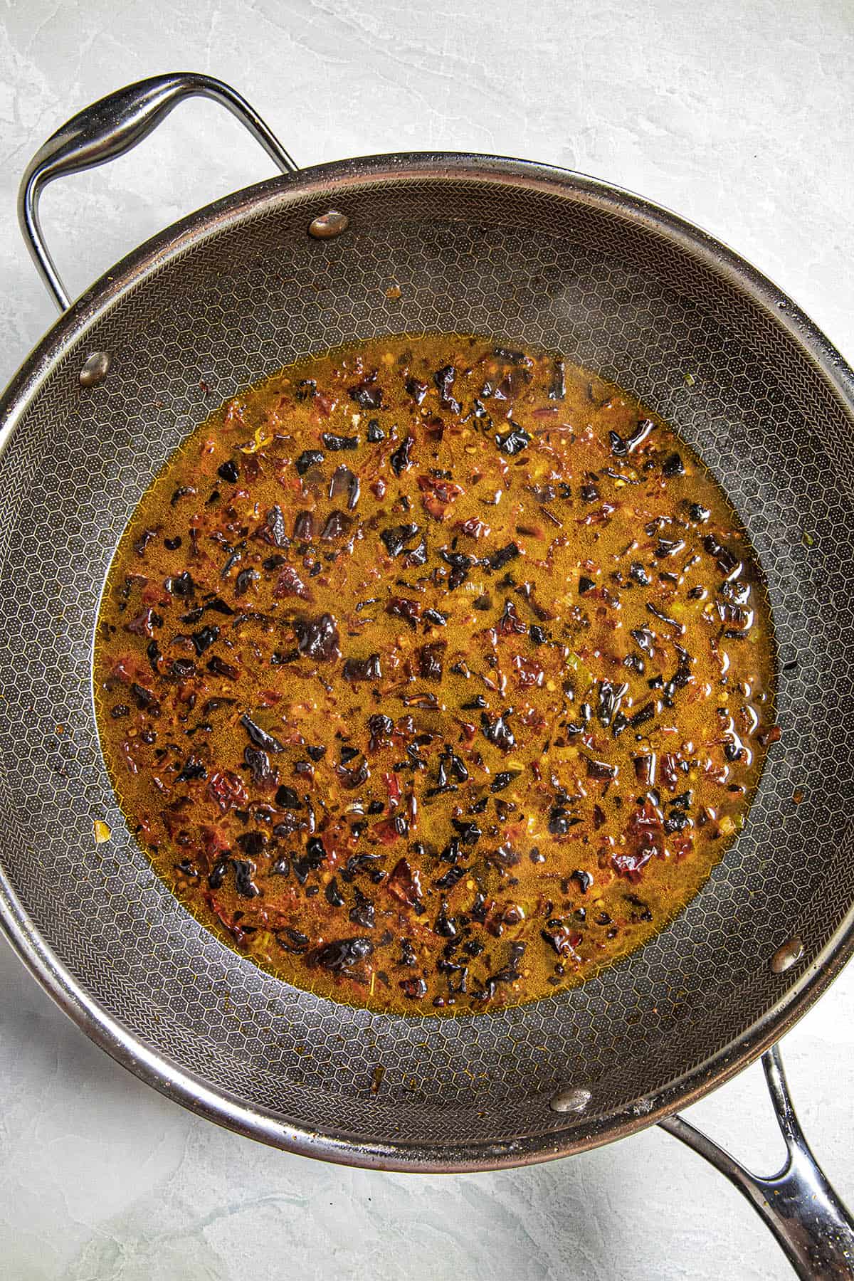 Simmering the Shuizhu Yu broth in a hot pan