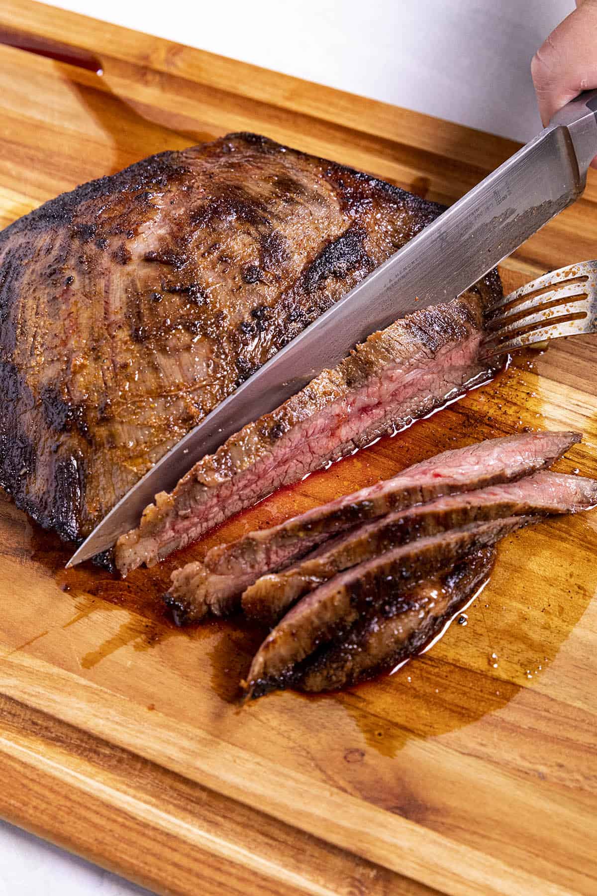 Slicing steak against the grain to make Steak Fajitas