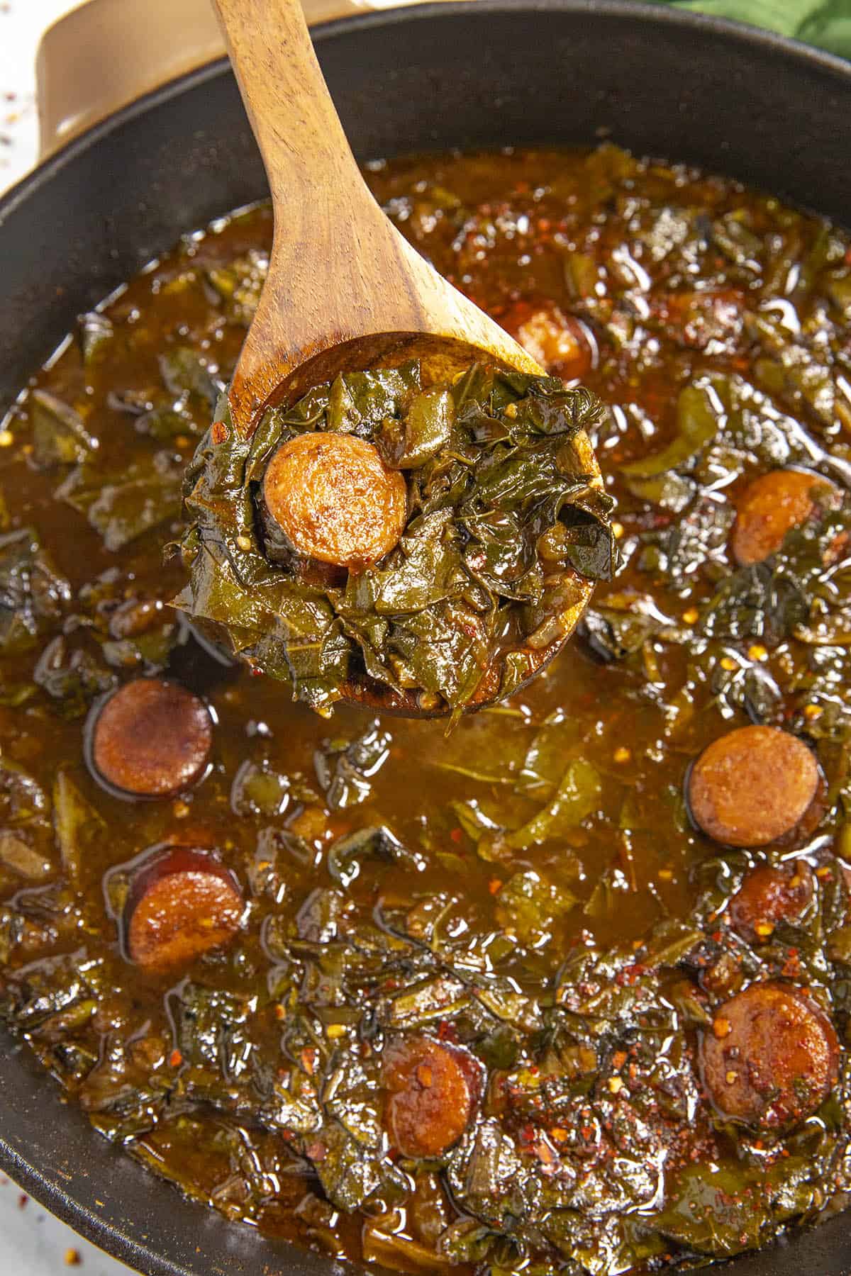 Mike scooping Gumbo Zherbes onto a serving spoon